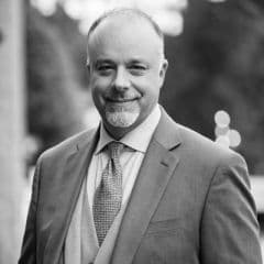 Headshot of Justin Dilenschneider from Avison Young