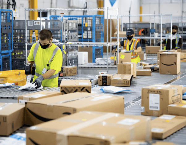Workers sorting parcels in a distribution centre